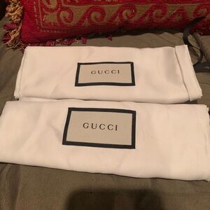 Gucci dust  bags. White fabric with black accents. Ideal for shoes